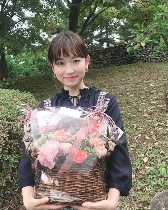 Kim Seulgi in Kim Seulgi stands with a flower basket